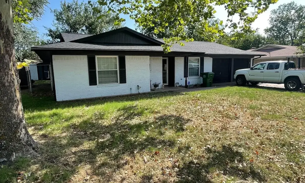 Professional roofing crew working on a residential roof in Flossmoor